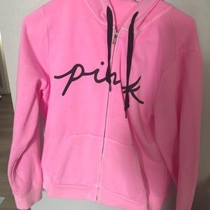 pink jacket. has stain on sleeve
